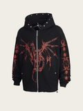 Black hoodie with red designs on a beige background