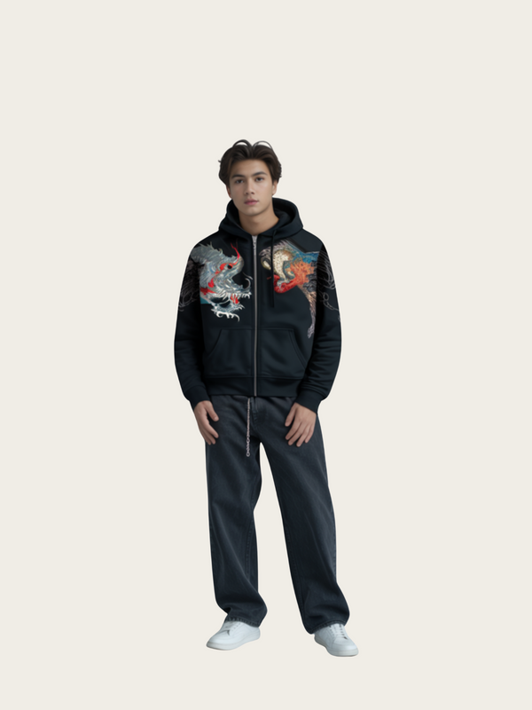 Person wearing a black hoodie with colorful designs on a light gray background