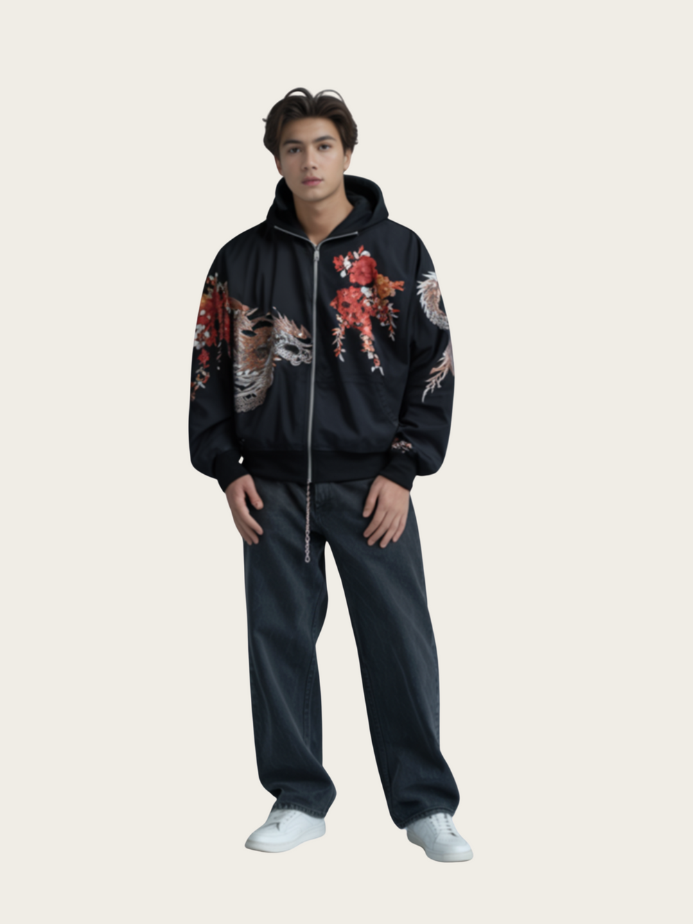 Person wearing a black hoodie with colorful designs on a plain background