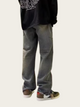 Person wearing gray pants and a black hoodie on a white background
