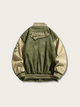 Green and beige varsity jacket with 'Hantaly' branding on a light gray background