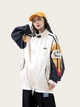 Person wearing a colorful jacket with a mountain logo on a plain background