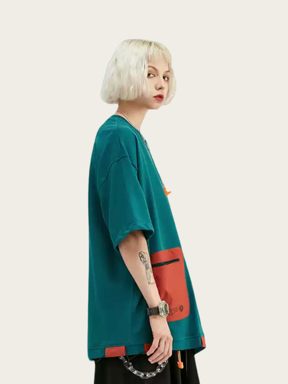 Person wearing a teal and red jacket on a white background