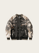 Black and white jacket with dragon embroidery on a beige background