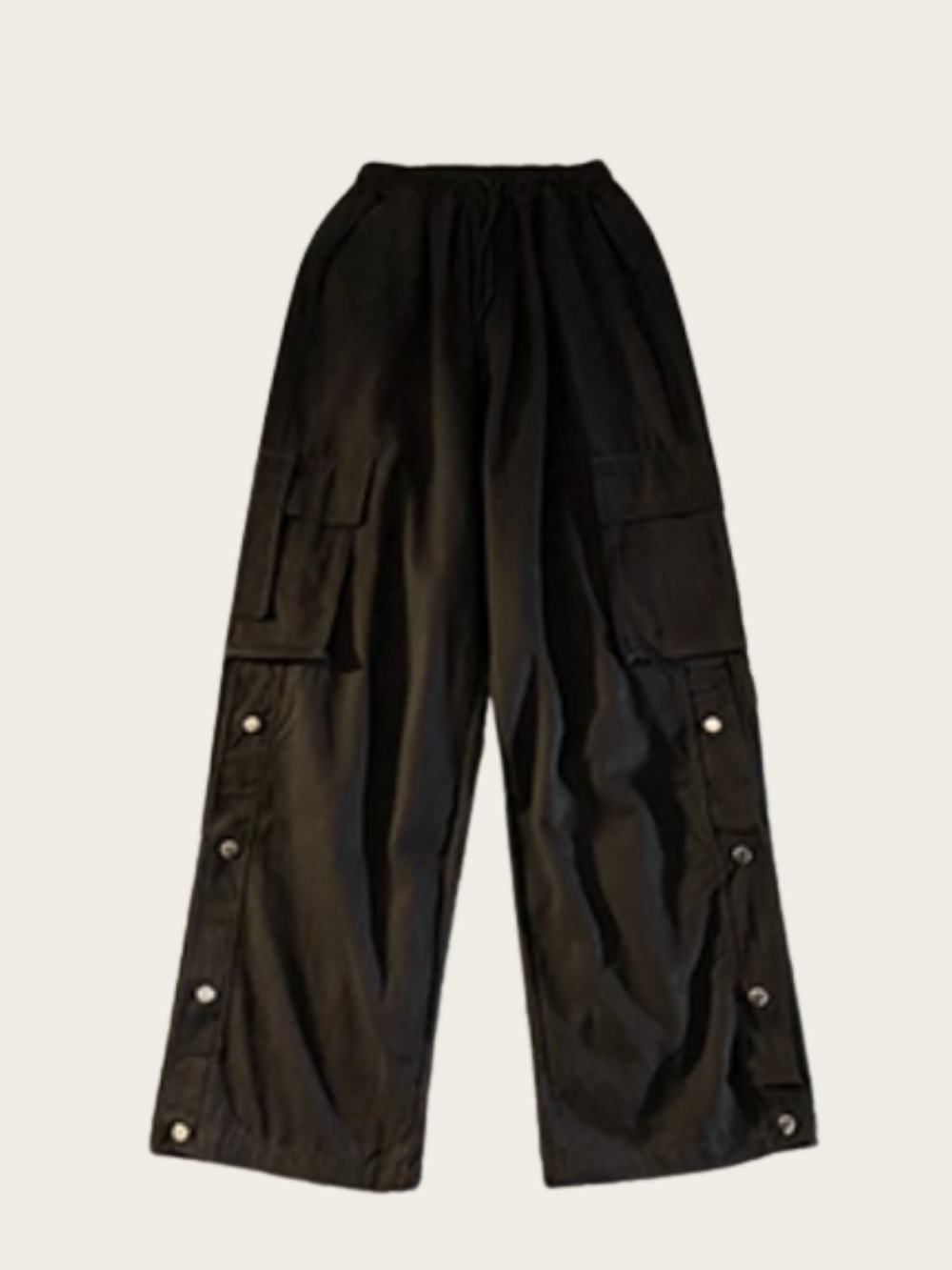 Black cargo pants with button details on a light gray background