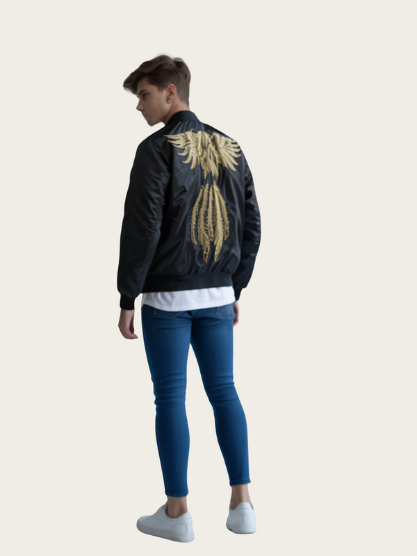 Person wearing a black bomber jacket with gold eagle design on the back, standing against a plain background.