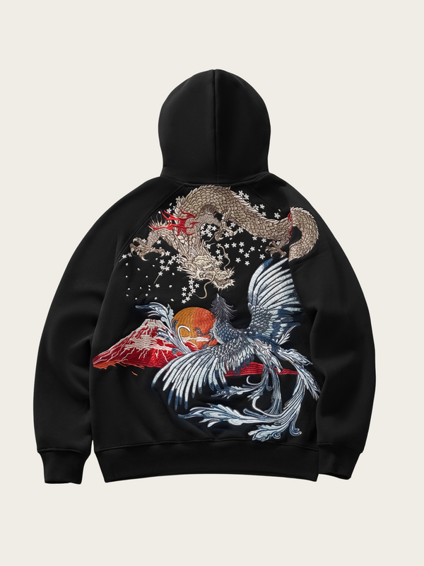 Black hoodie with dragon and phoenix design on a beige background