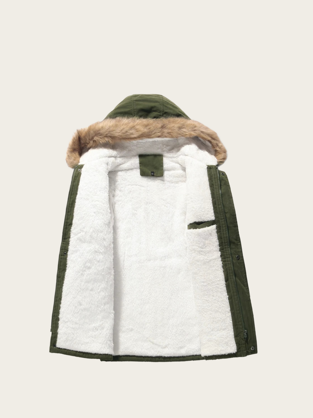 Green and white quilted jacket with fur-lined hood on a beige background