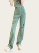 Light blue distressed jeans worn by a person on a white background