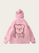 Pink children's hoodie with bear design on a light pink background