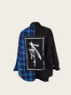 Black jacket with blue plaid pattern and white logo on a light gray background