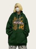 Person wearing a green hoodie with a dragon design and text, on a plain background