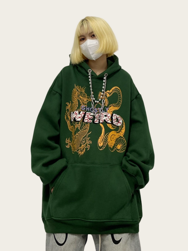 Person wearing a green hoodie with a dragon design and text, on a plain background