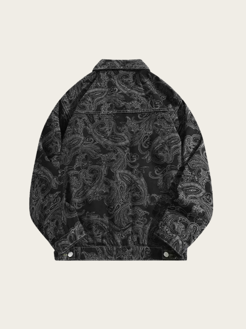 Black patterned jacket on a beige background
