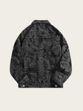 Black patterned jacket on a beige background