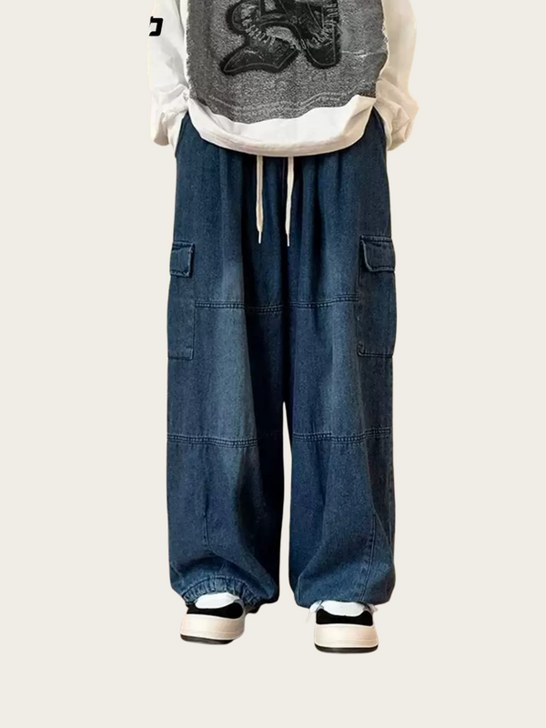 Person wearing blue cargo pants with a white shirt and gray vest on a white background