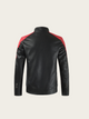 Black leather jacket with red accents on a beige background