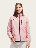 Person wearing a pink jacket with a white background
