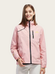 Person wearing a pink jacket with a white background