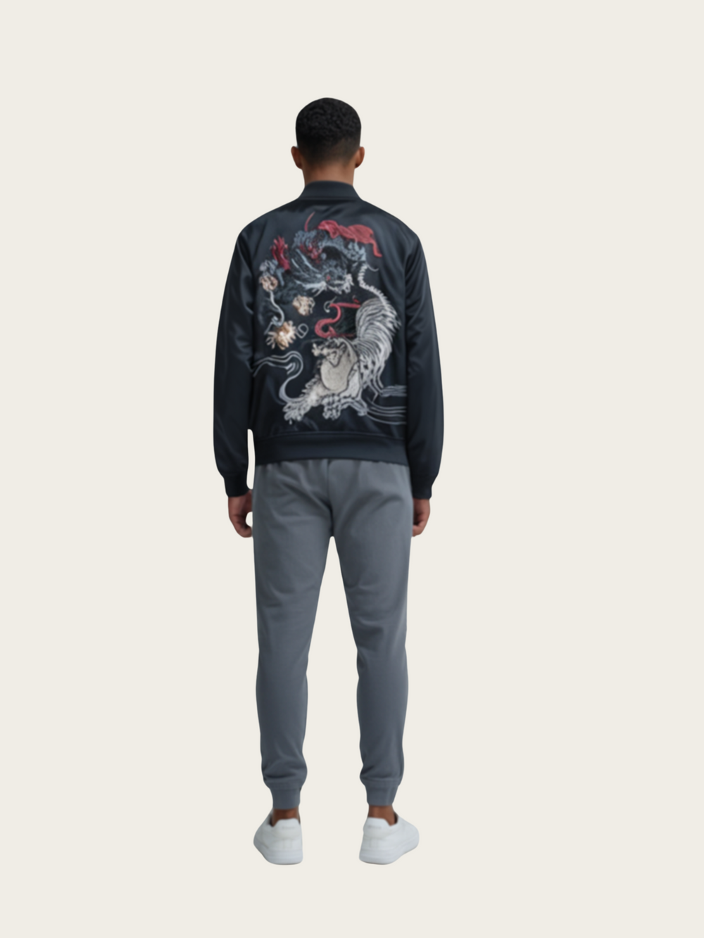 Person wearing a dark jacket with a colorful design on the back against a white background