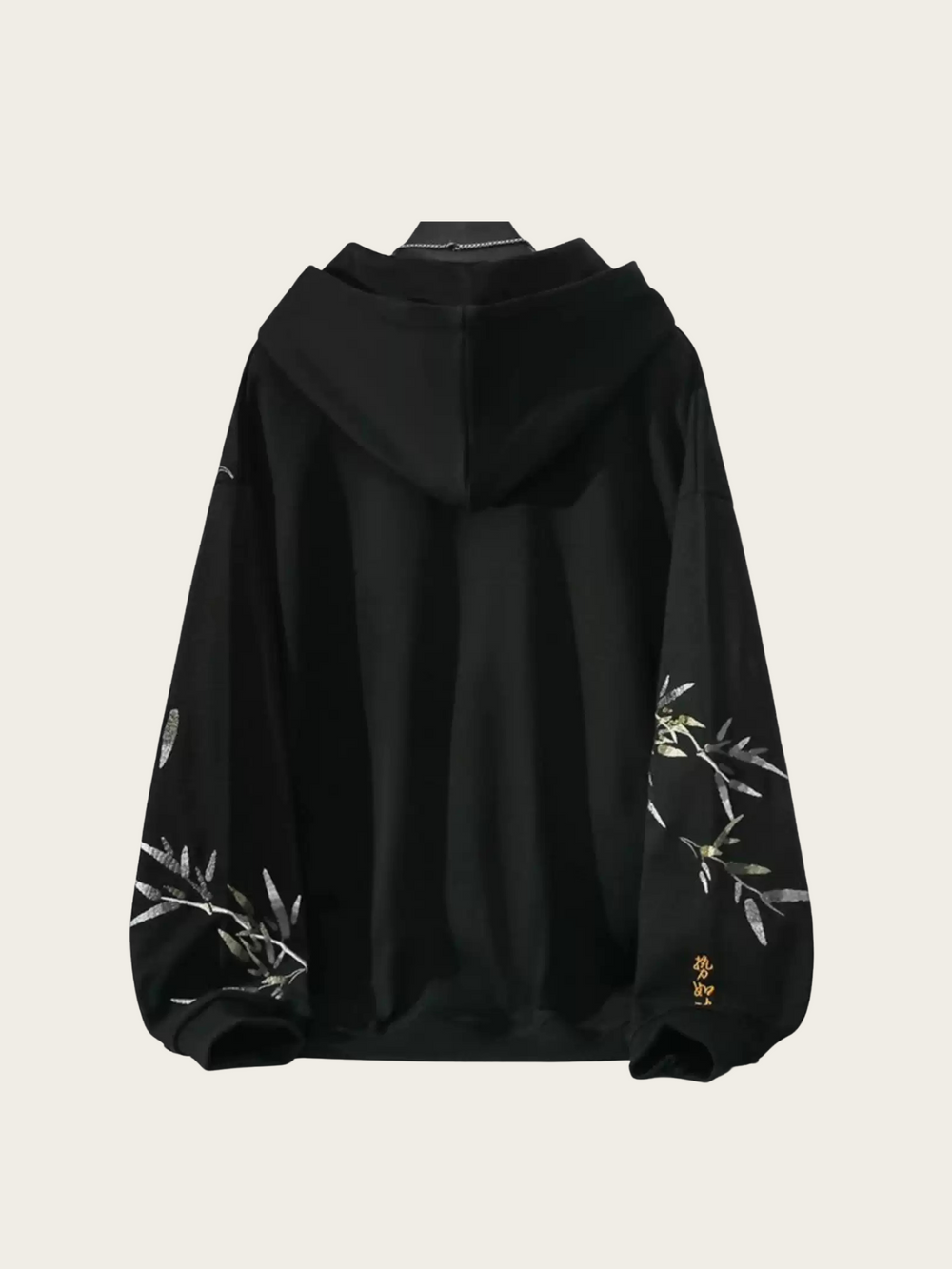 Black hoodie with floral embroidery on a light gray background