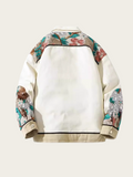 White jacket with floral sleeves on a beige background