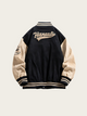 Black and beige varsity jacket with 'Hankut' branding on a light beige background