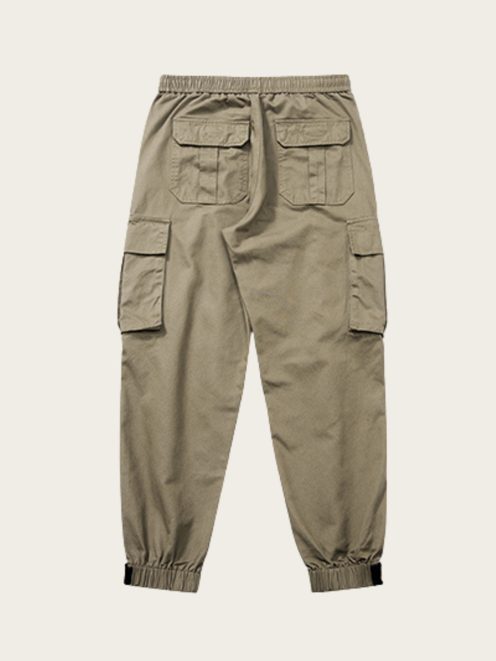 Khaki cargo pants on a beige background