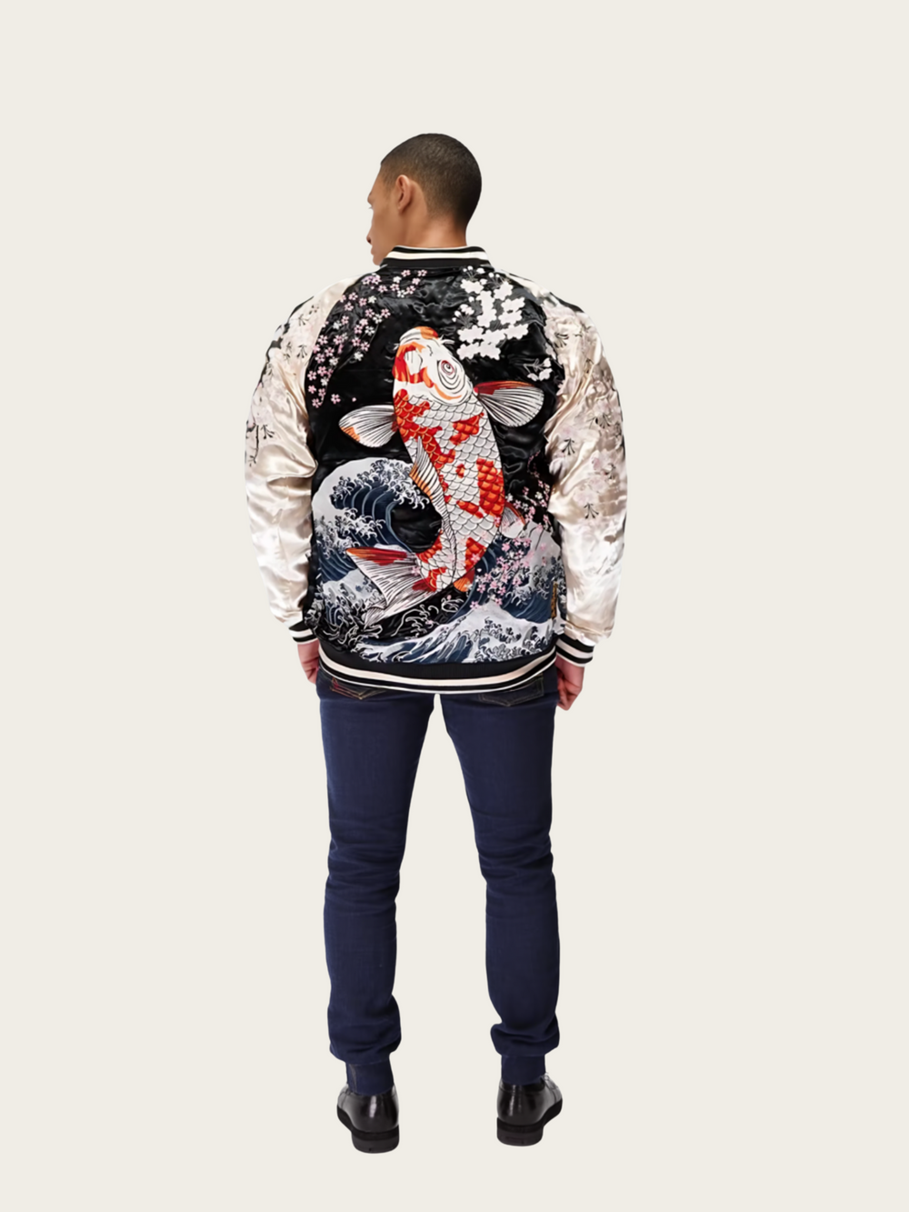 Person wearing a jacket with a koi fish design on a plain background