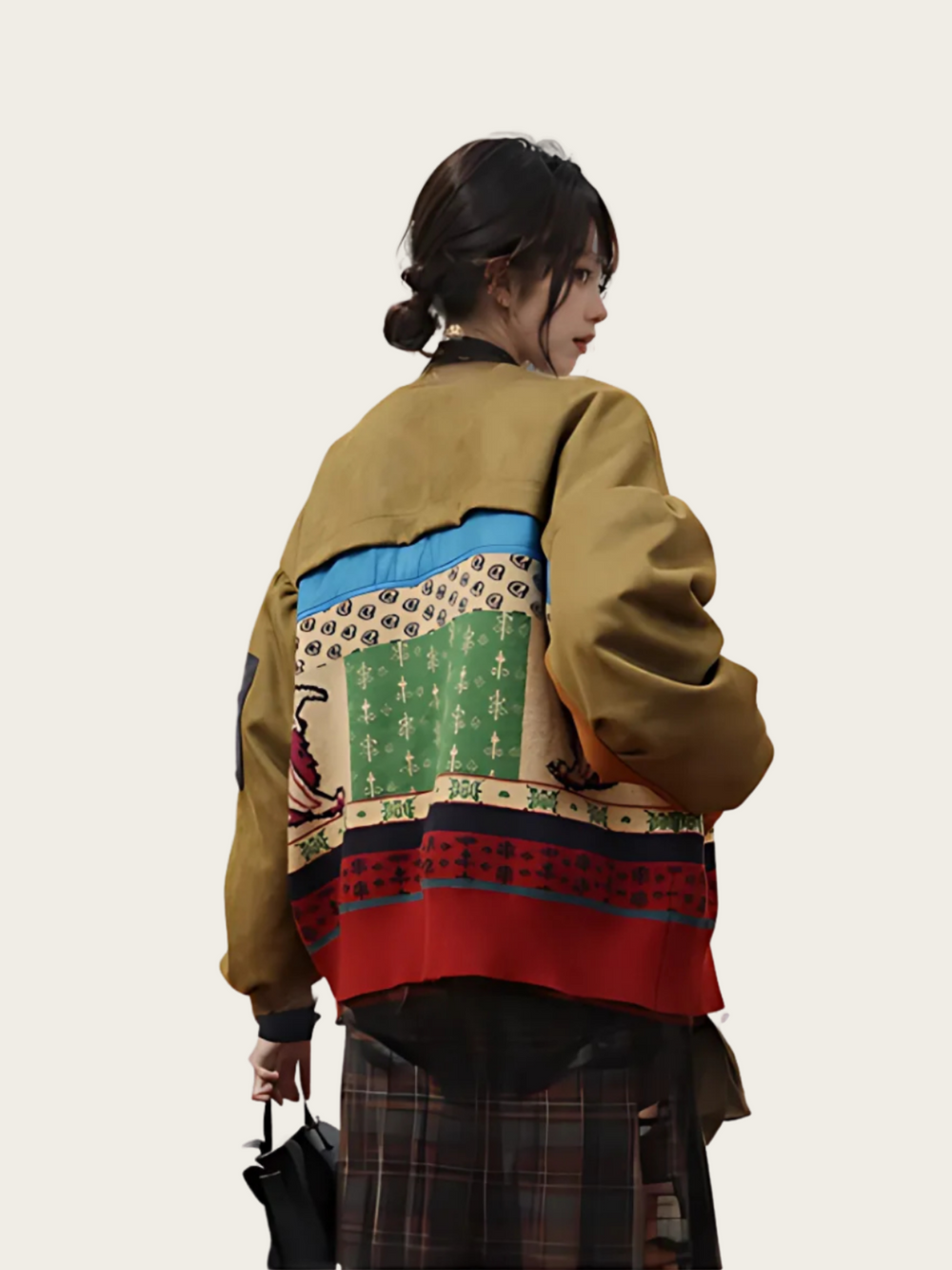 Person wearing a colorful patterned jacket on a plain background