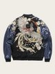 Jacket with phoenix and floral design on a beige background