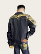 Person wearing a black jacket with gold embroidery on a plain background