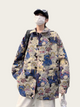 Person wearing a colorful teddy bear patterned coat on a white background