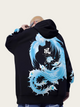 Person wearing a black hoodie with a blue and white dragon design on the back.