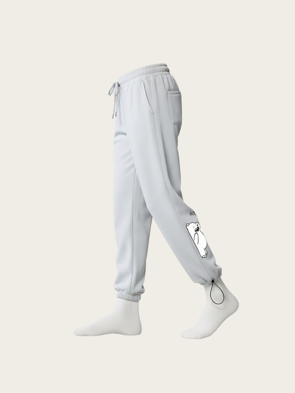 Light gray sweatpants worn by a person on a white background