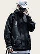 Person wearing a black jacket with a logo, white cap, and backpack on a light background