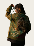 Person wearing a green embroidered jacket with a white background