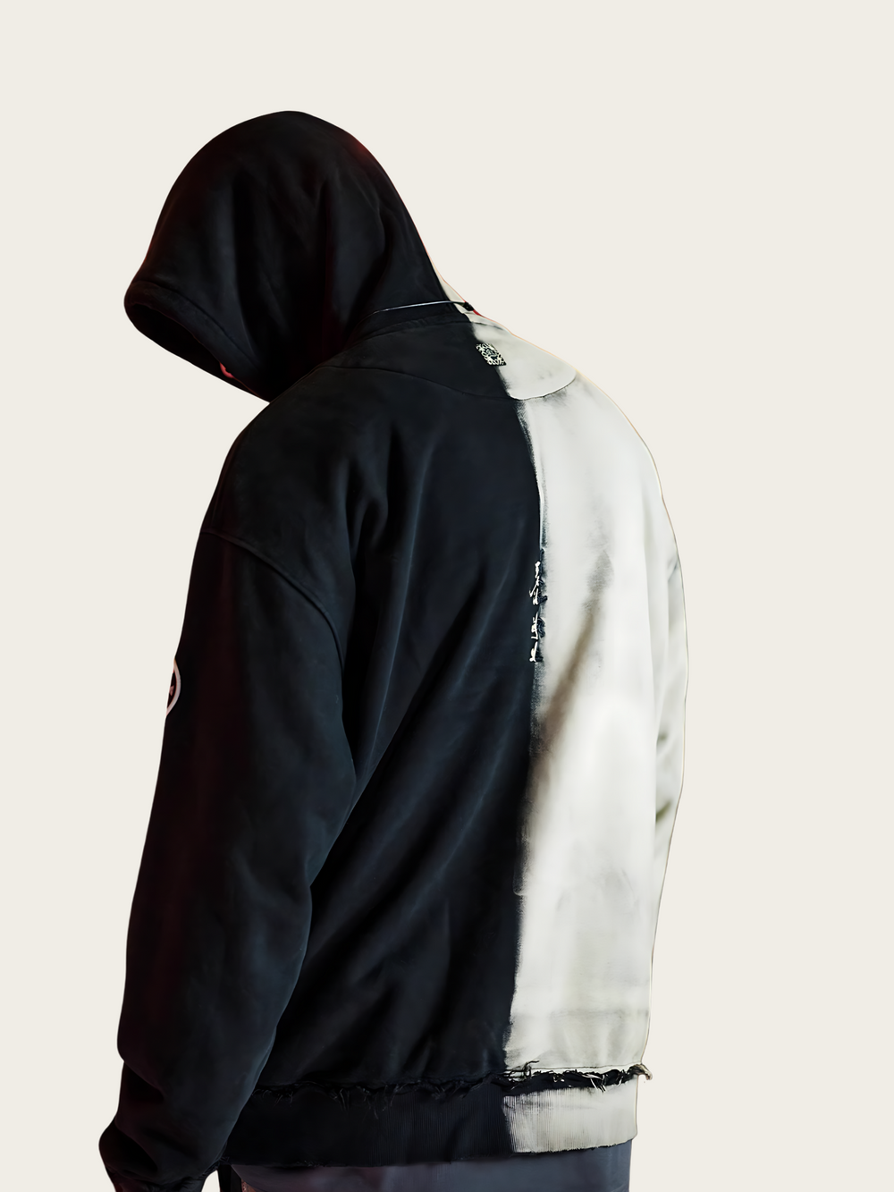 Person wearing a black and white jacket with a hood on a plain background