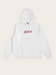 White hoodie with red text on a light beige background