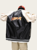 Person wearing a black varsity jacket with 'SAHMOME' text on the back, standing against a plain background.