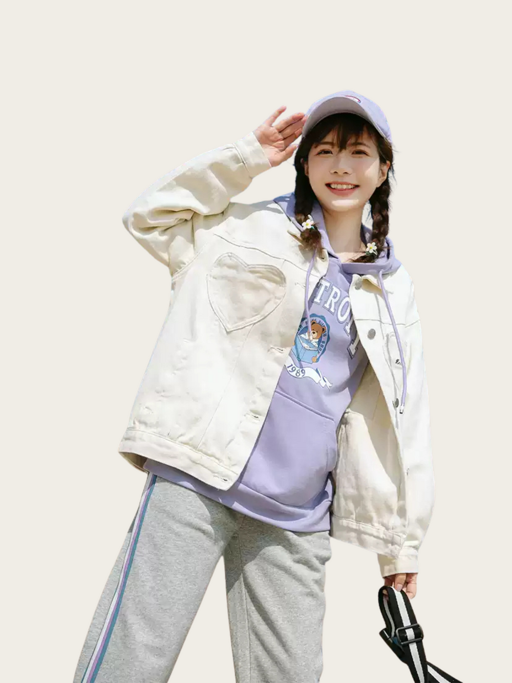 Person wearing a white jacket, purple hoodie, and gray pants on a plain background