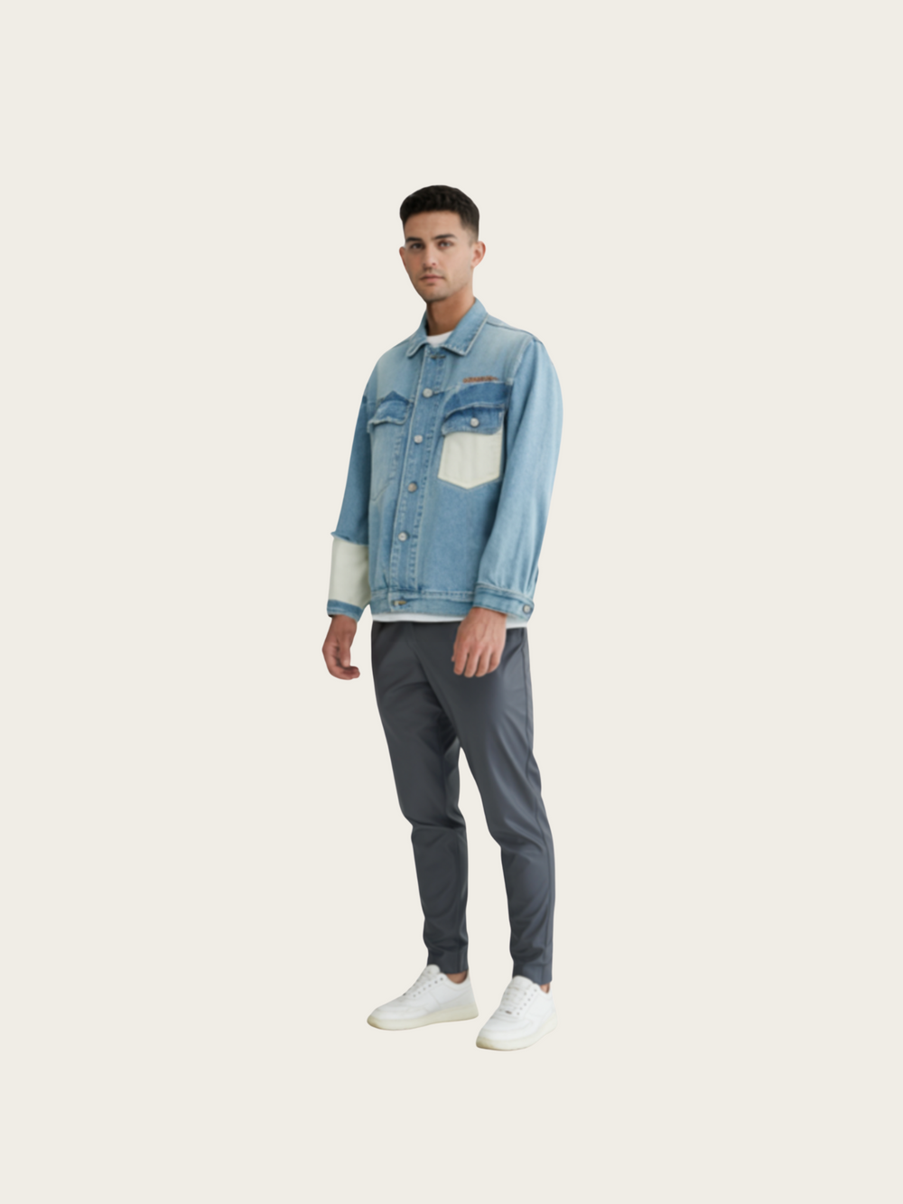 Man wearing a denim jacket and gray pants on a white background