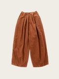 Brown wide-leg pants on a beige background
