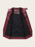 Black jacket with burgundy leather sleeves on a beige background