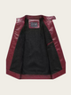 Black jacket with burgundy leather sleeves on a beige background