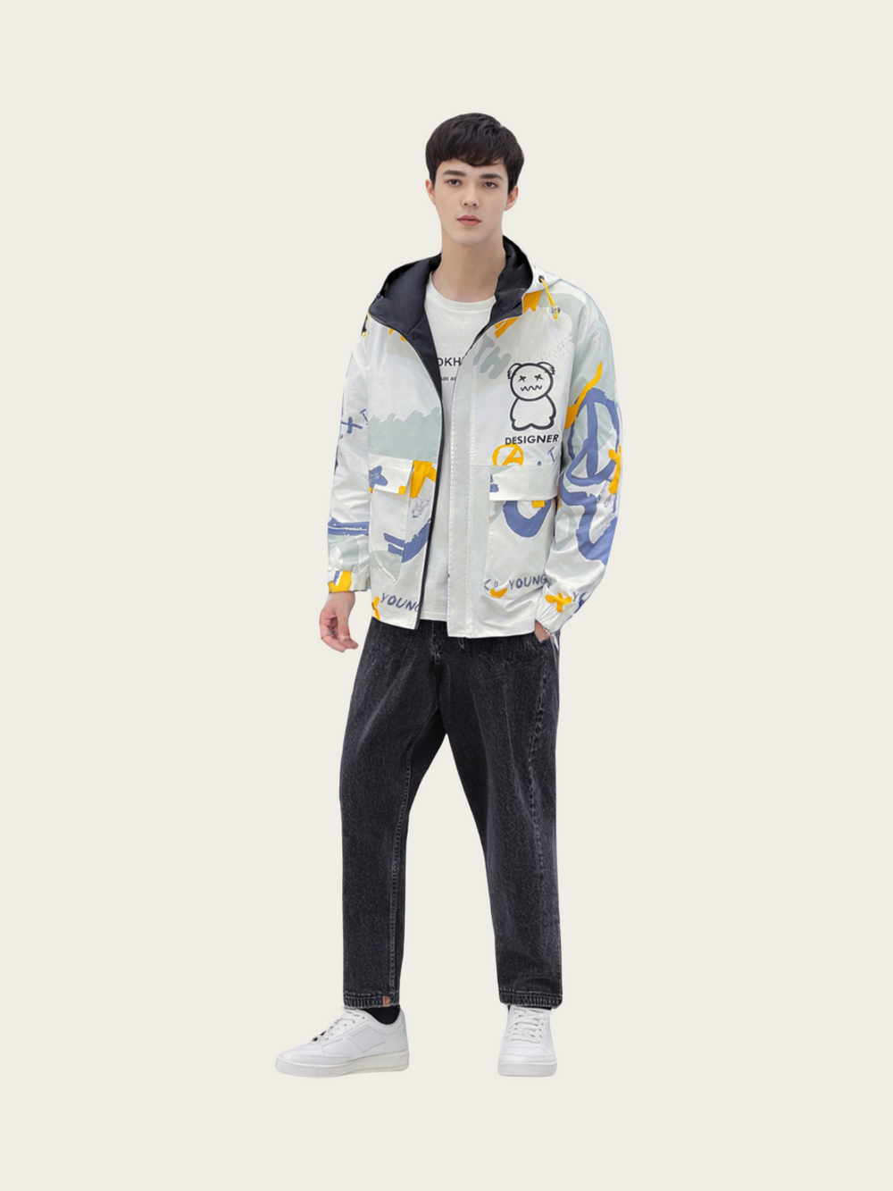 Person wearing a colorful jacket with cartoon character design on a white background