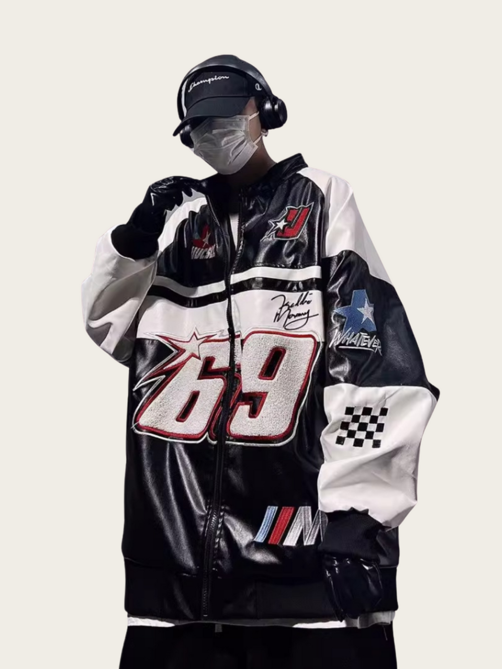 Person wearing a black, white, and red jacket with various logos and numbers on a white background