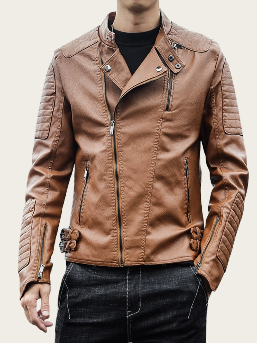 Brown leather jacket worn by a person on a plain background
