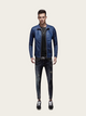 Man wearing a blue leather jacket and black jeans on a white background