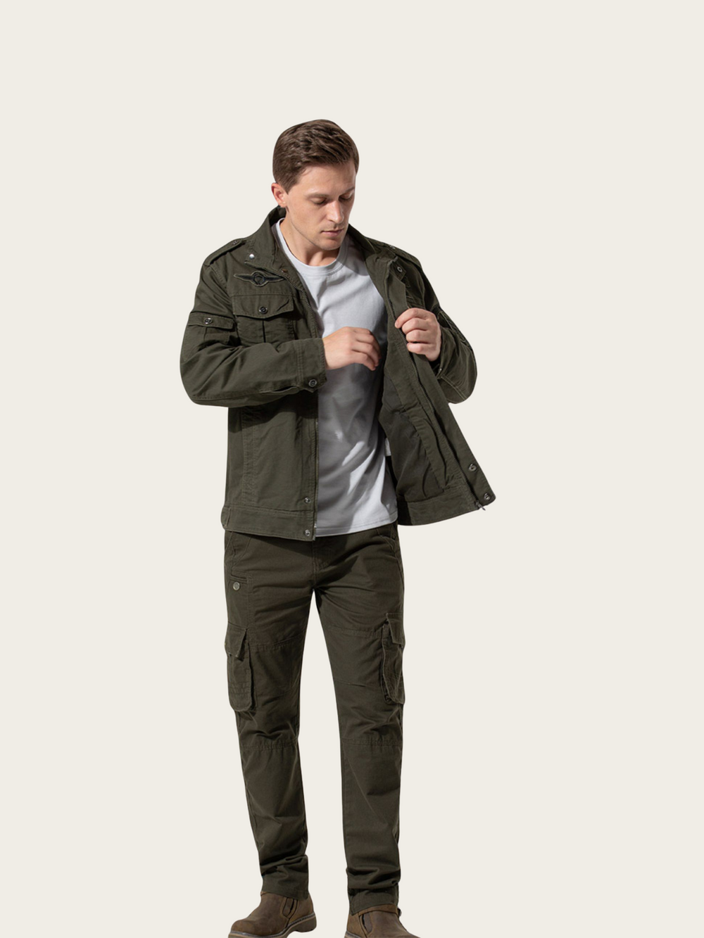 Man wearing a green jacket and pants on a white background